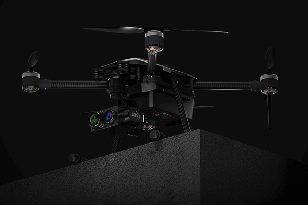 The black coloured drone is on the edge of the terrace with the whole dark black background