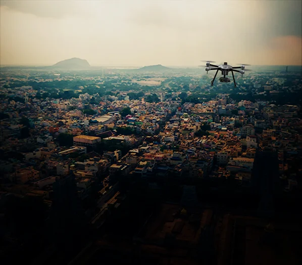 view of city filled of houses and clear sky view and cyberone drone is flying